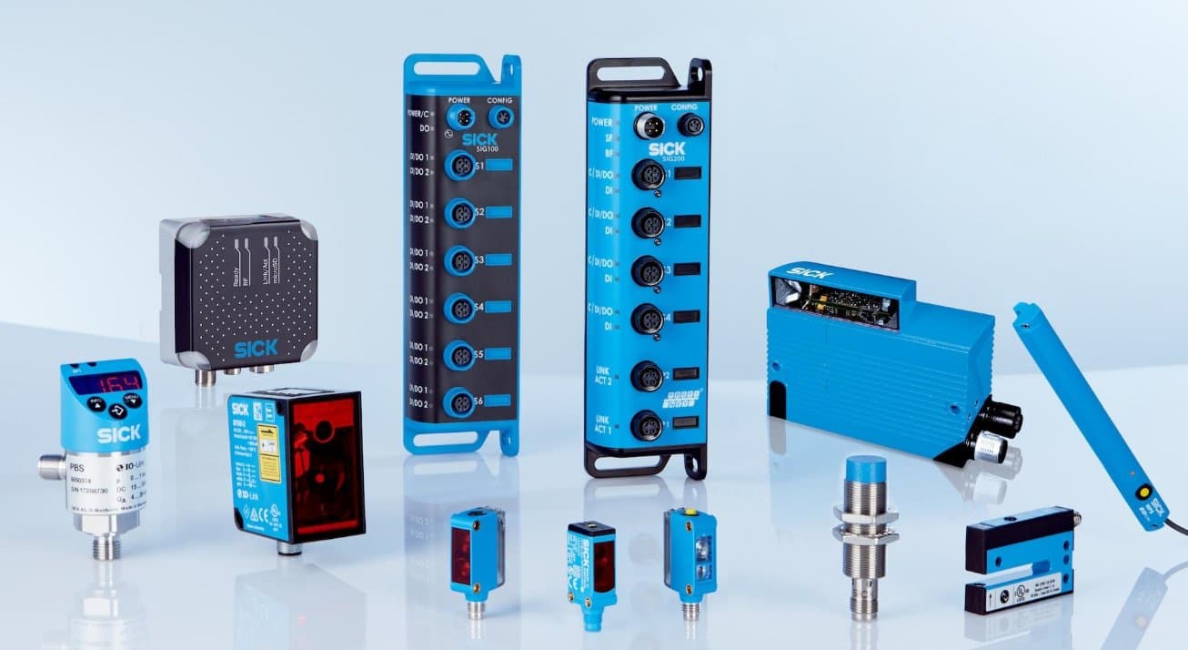 Industrial photoelectric and proximity sensors alongside PLC I/O modules